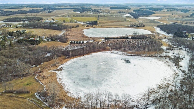 birds eye view of property with a rural view