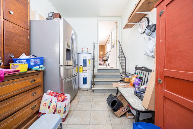 kitchen featuring water heater, stainless steel fridge with ice dispenser, and light tile patterned floors