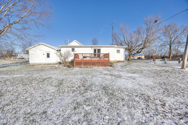 back of property with a wooden deck