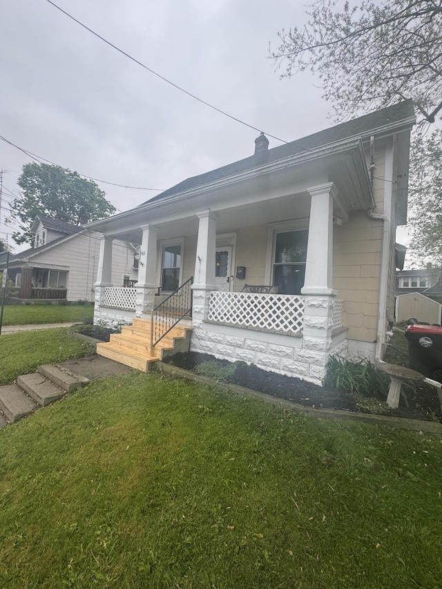 411 Middle St, Wapakoneta, OH 45895 - view of front of property with covered porch and a front yard