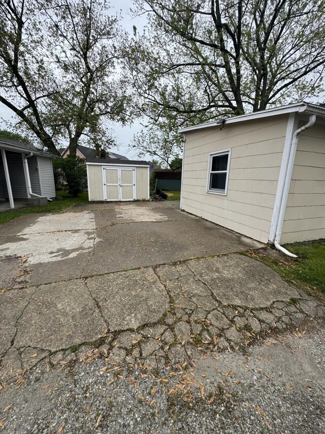 411 Middle St, Wapakoneta, OH 45895 - garage featuring a storage unit