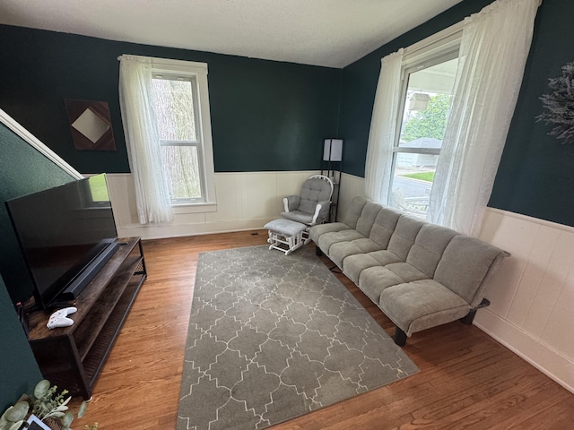 411 Middle St, Wapakoneta, OH 45895 - living area with a wainscoted wall, plenty of natural light, and wood finished floors