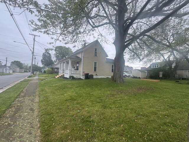 411 Middle St, Wapakoneta, OH 45895 - view of side of property featuring a lawn