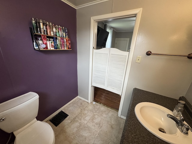 411 Middle St, Wapakoneta, OH 45895 - bathroom with baseboards, a sink, and toilet
