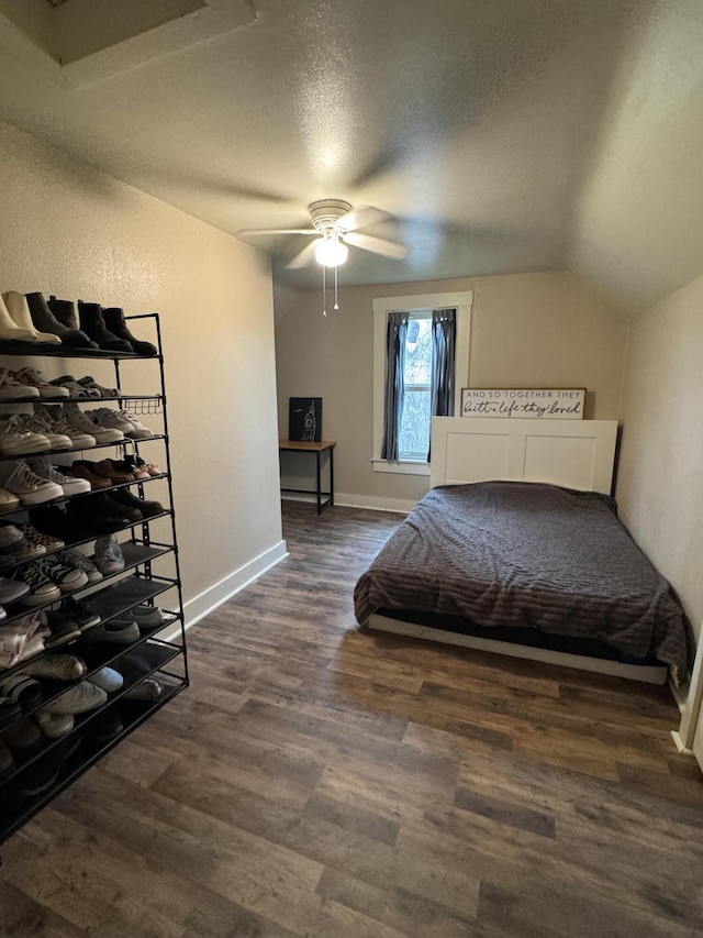 411 Middle St, Wapakoneta, OH 45895 - bedroom with dark wood-type flooring, baseboards, a textured ceiling, lofted ceiling, and ceiling fan