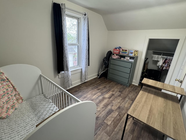 411 Middle St, Wapakoneta, OH 45895 - bedroom featuring lofted ceiling, dark wood-style floors, and baseboards