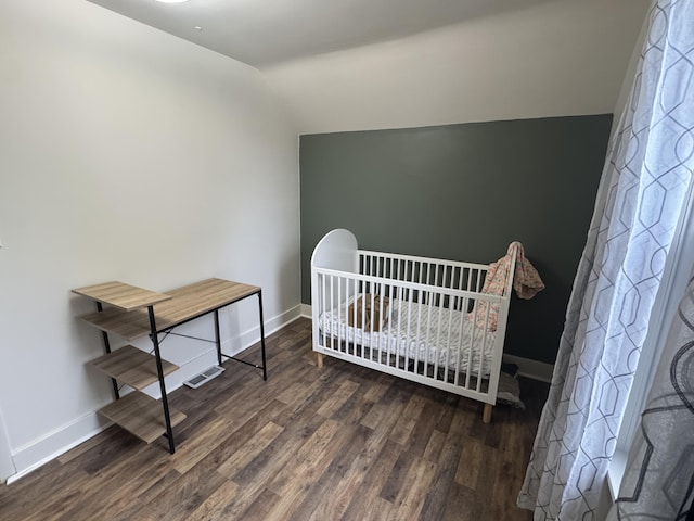 411 Middle St, Wapakoneta, OH 45895 - bedroom with lofted ceiling, wood finished floors, and baseboards