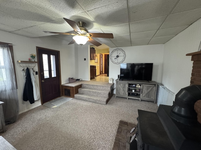 411 Middle St, Wapakoneta, OH 45895 - living room featuring a drop ceiling, light carpet, and ceiling fan