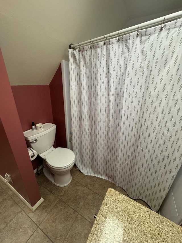 411 Middle St, Wapakoneta, OH 45895 - full bath featuring toilet, tile patterned flooring, a shower with curtain, and lofted ceiling