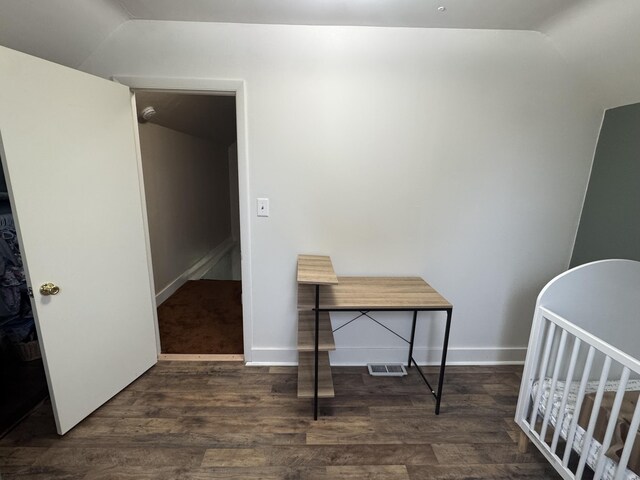 411 Middle St, Wapakoneta, OH 45895 - bedroom with wood finished floors, lofted ceiling, and baseboards