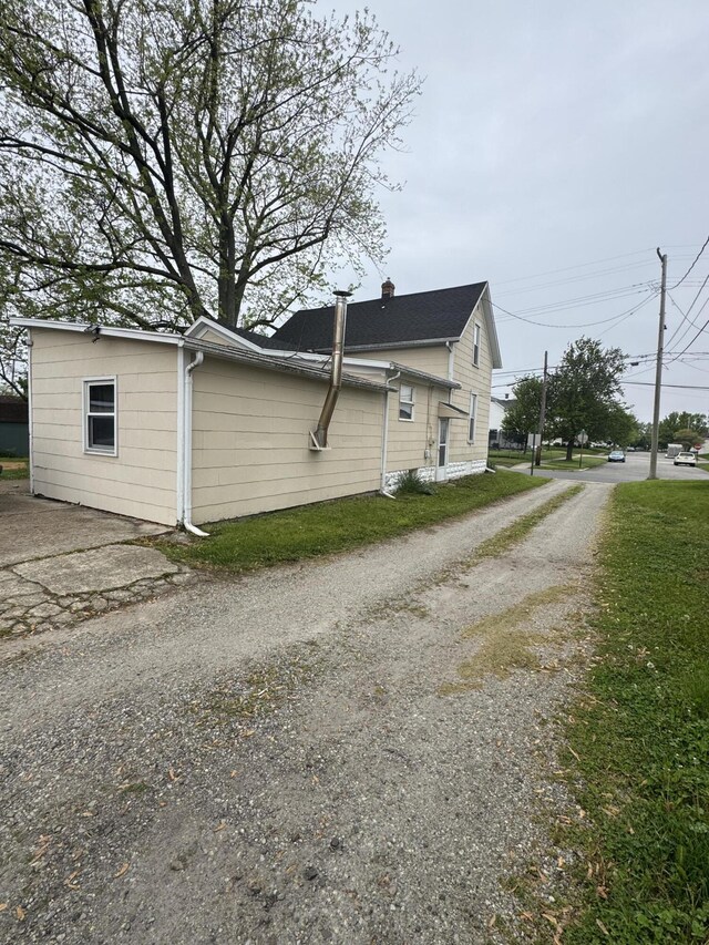 411 Middle St, Wapakoneta, OH 45895 - view of side of property with gravel driveway