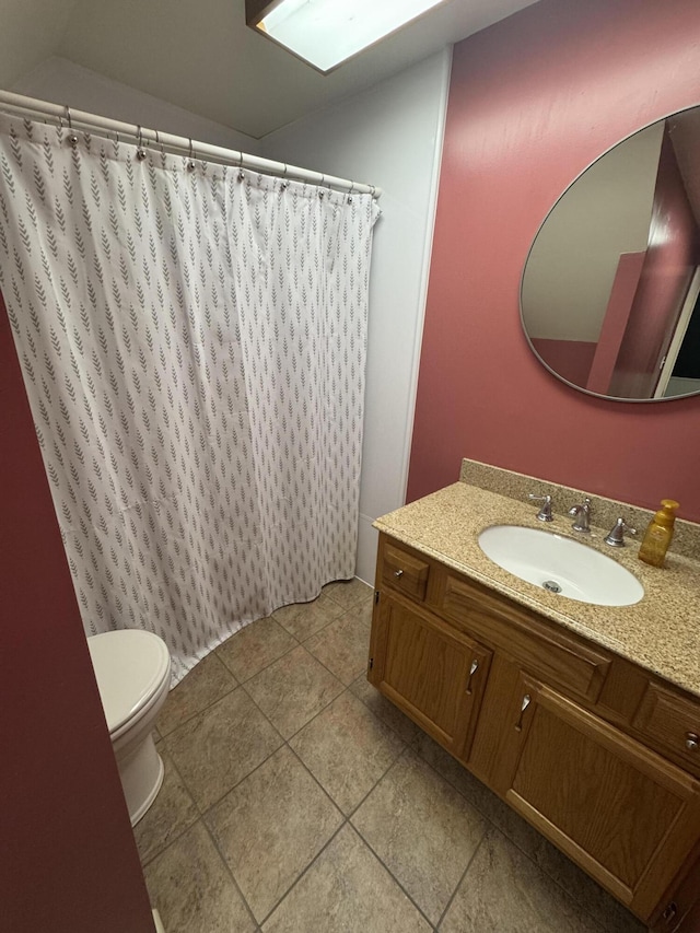 411 Middle St, Wapakoneta, OH 45895 - bathroom with toilet, tile patterned flooring, vanity, and a shower with shower curtain