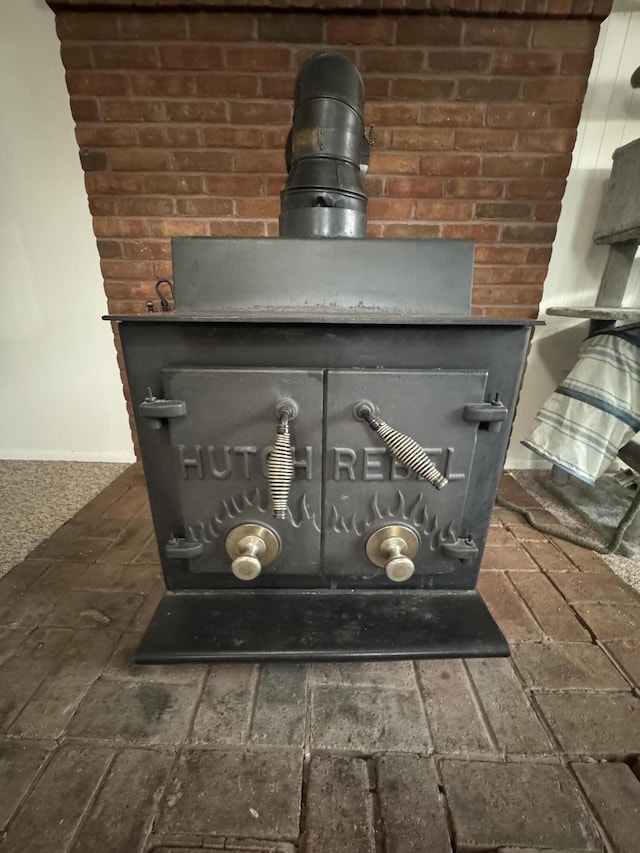 411 Middle St, Wapakoneta, OH 45895 - detailed view of a wood stove and baseboards
