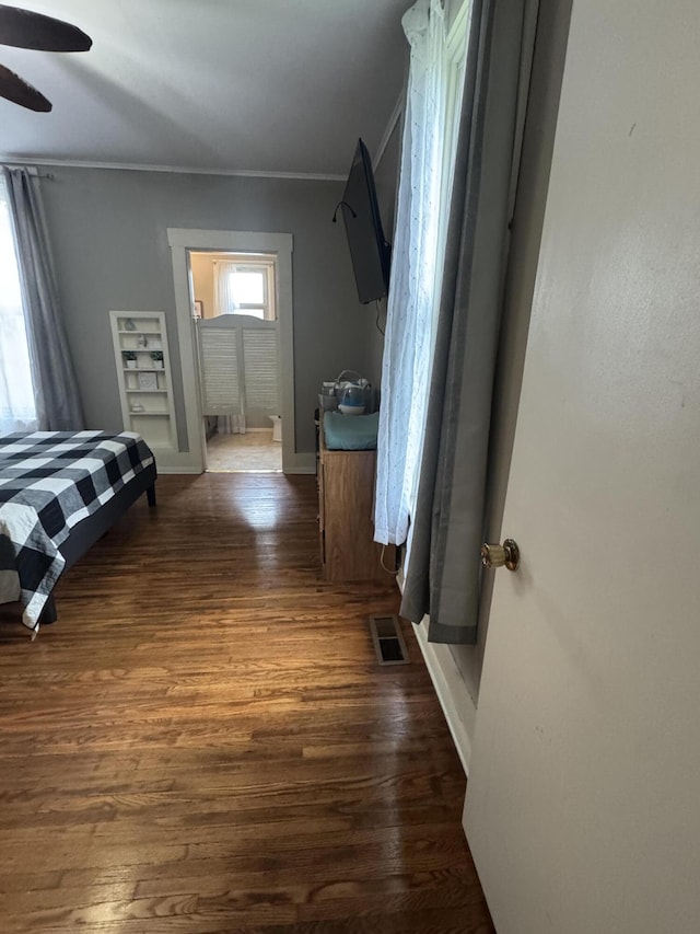 411 Middle St, Wapakoneta, OH 45895 - bedroom with wood finished floors, baseboards, ornamental molding, and a ceiling fan