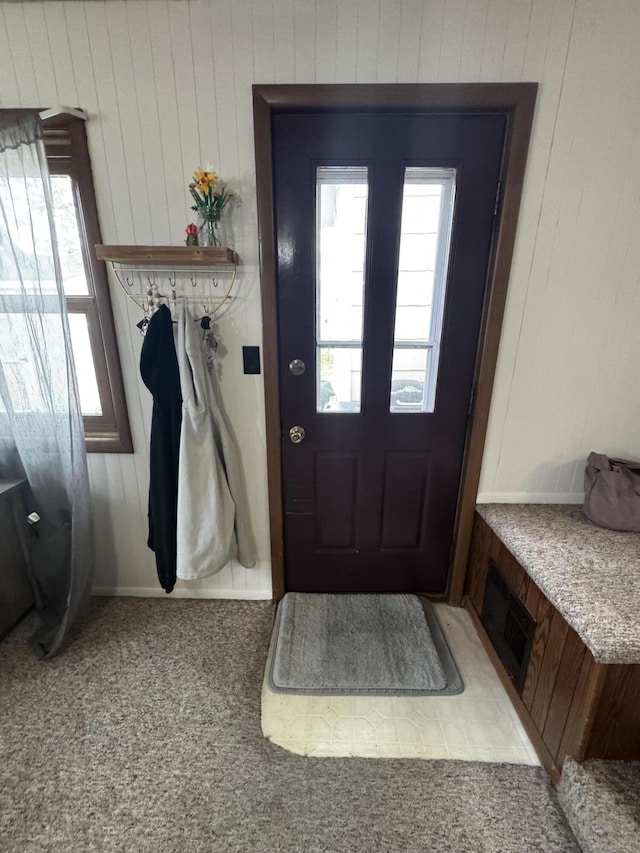 411 Middle St, Wapakoneta, OH 45895 - mudroom with healthy amount of natural light, wood walls, and carpet floors