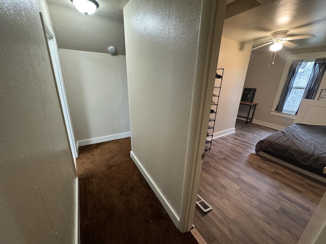 411 Middle St, Wapakoneta, OH 45895 - bedroom with baseboards, a textured wall, and wood finished floors