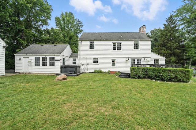 650 Swailes Rd, Troy, OH 45373 - rear view of property featuring a hot tub, a wooden deck, a chimney, and a lawn