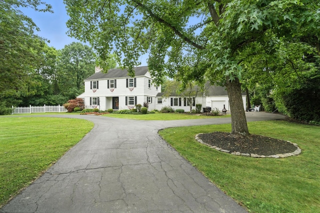 650 Swailes Rd, Troy, OH 45373 - view of front of house featuring curved driveway and a chimney