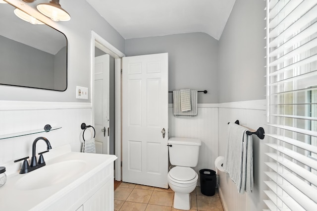 650 Swailes Rd, Troy, OH 45373 - bathroom with a wainscoted wall, tile patterned floors, lofted ceiling, and vanity