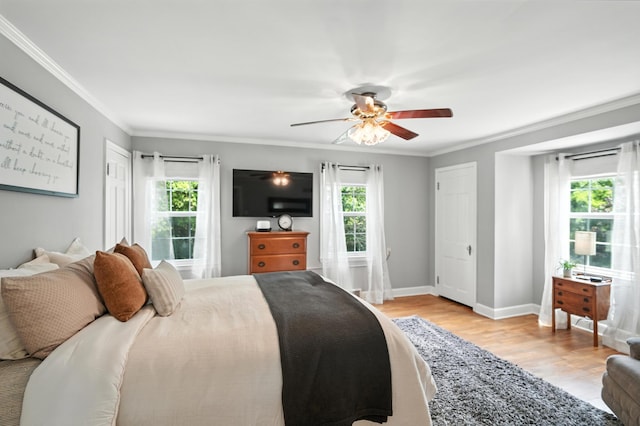 650 Swailes Rd, Troy, OH 45373 - bedroom featuring multiple windows, light wood finished floors, ornamental molding, and a ceiling fan