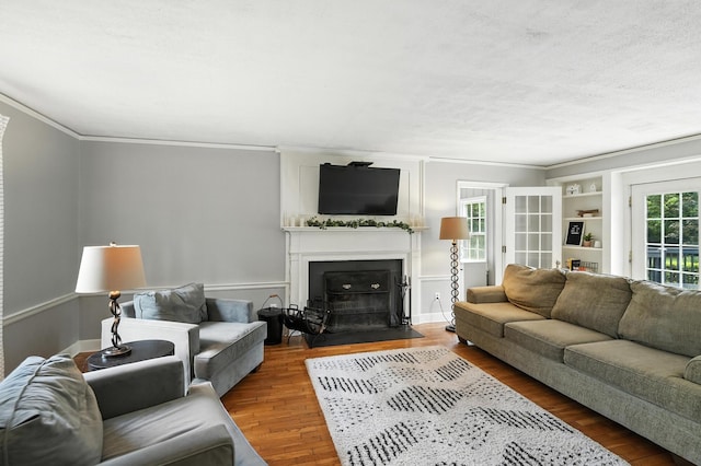 650 Swailes Rd, Troy, OH 45373 - living room featuring crown molding, wood finished floors, and a large fireplace