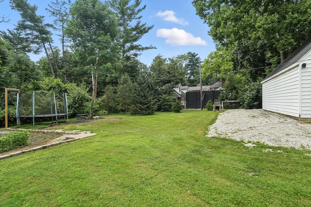 650 Swailes Rd, Troy, OH 45373 - view of green lawn with a trampoline