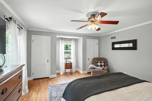 650 Swailes Rd, Troy, OH 45373 - bedroom with light wood-style floors, crown molding, and a ceiling fan