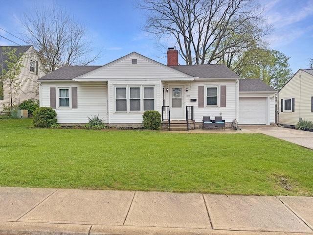 view of front of home featuring a chimney, a front yard, a garage, concrete driveway, and a shingled roof