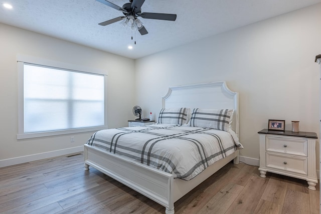 210 N Branch, Tipp City, OH 45371 - bedroom with light wood-type flooring, recessed lighting, a ceiling fan, and a textured ceiling