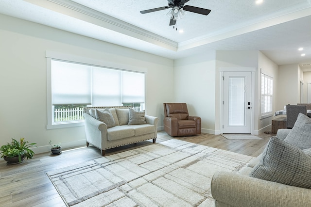 210 N Branch, Tipp City, OH 45371 - living room with wood finished floors, ornamental molding, a ceiling fan, recessed lighting, and a tray ceiling