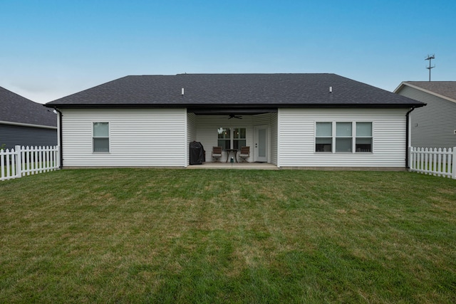 210 N Branch, Tipp City, OH 45371 - back of house with ceiling fan, a fenced backyard, a patio, and a shingled roof