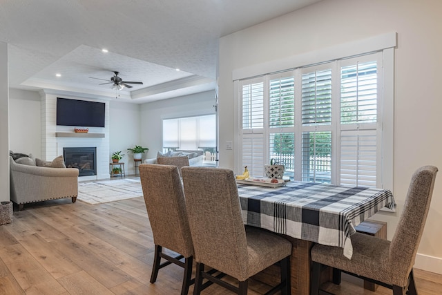 210 N Branch, Tipp City, OH 45371 - dining space with a raised ceiling, healthy amount of natural light, a ceiling fan, light wood-type flooring, and recessed lighting