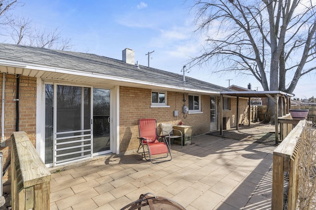 back of property featuring a patio area