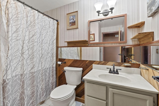 bathroom featuring vanity, an inviting chandelier, and toilet