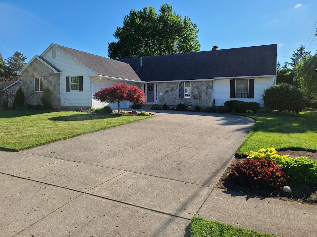 ranch-style house with a front lawn