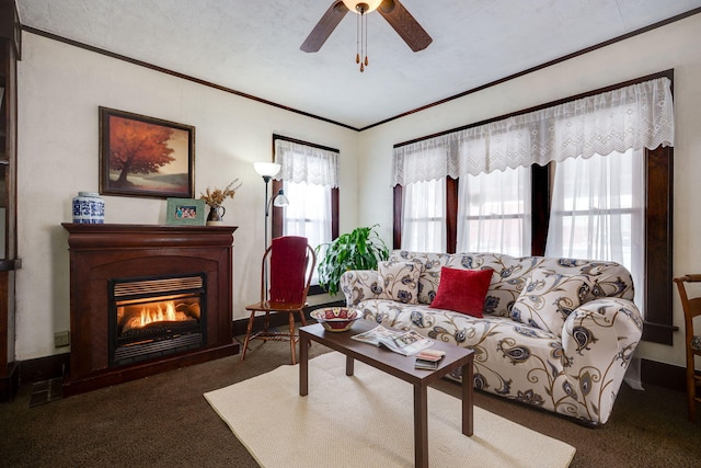 carpeted living room with ceiling fan, crown molding, and a textured ceiling