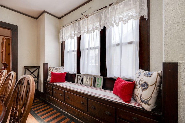 living area featuring ornamental molding