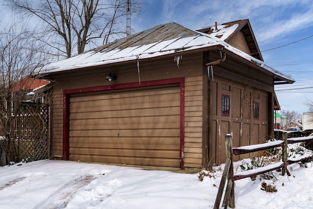 view of snow covered garage