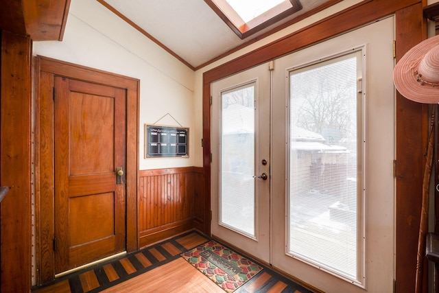 doorway to outside with french doors, crown molding, dark hardwood / wood-style floors, and plenty of natural light