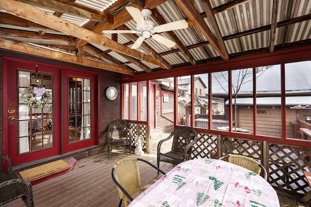 sunroom / solarium featuring vaulted ceiling and ceiling fan