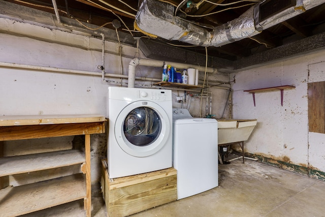 laundry area featuring washer and dryer and sink