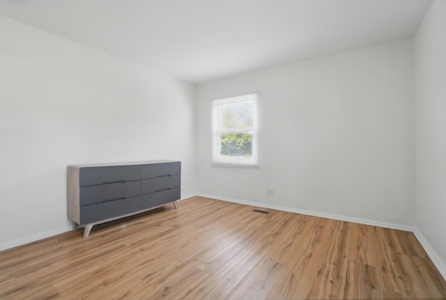 202 Fairfield Pike Unit A, Yellow Springs, OH 45387 - unfurnished room featuring baseboards, wood finished floors, and visible vents