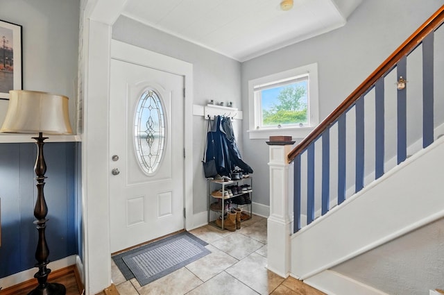 716 E Madison Ave, Springfield, OH 45503 - entryway featuring stairway, tile patterned floors, and baseboards