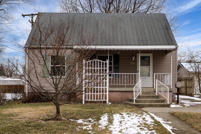 view of front of property featuring roof with shingles