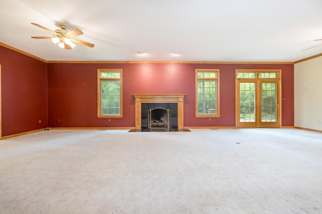 129 Tanglewood Dr, West Liberty, OH 43357 - unfurnished living room with ornamental molding, a ceiling fan, a premium fireplace, baseboards, and healthy amount of natural light