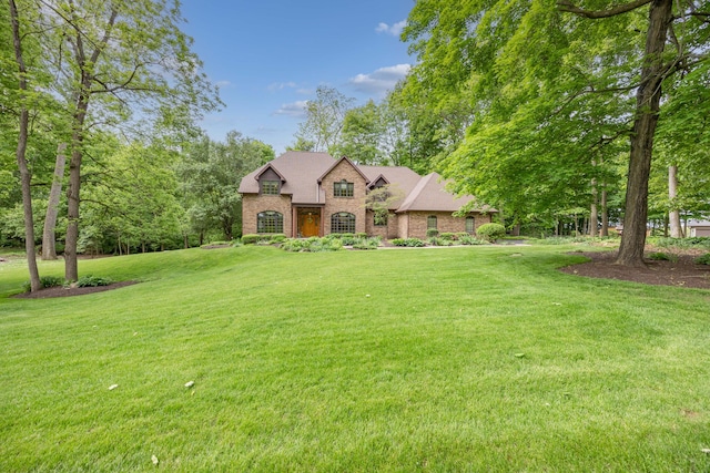 129 Tanglewood Dr, West Liberty, OH 43357 - view of front of home featuring a front lawn and brick siding