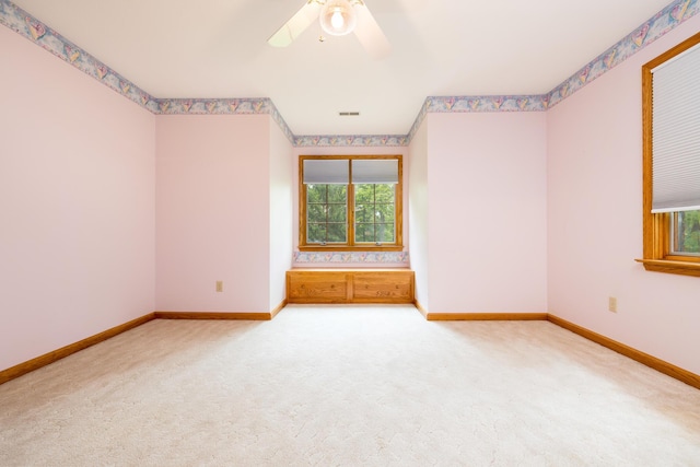 129 Tanglewood Dr, West Liberty, OH 43357 - carpeted spare room with baseboards and a ceiling fan