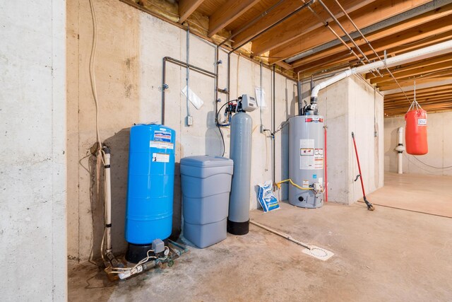129 Tanglewood Dr, West Liberty, OH 43357 - unfinished basement with gas water heater, a water softener system, and a water pressure tank