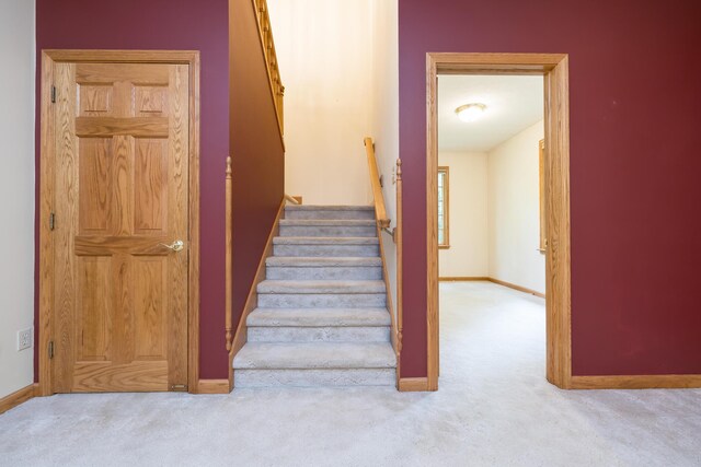 129 Tanglewood Dr, West Liberty, OH 43357 - stairway with carpet flooring and baseboards