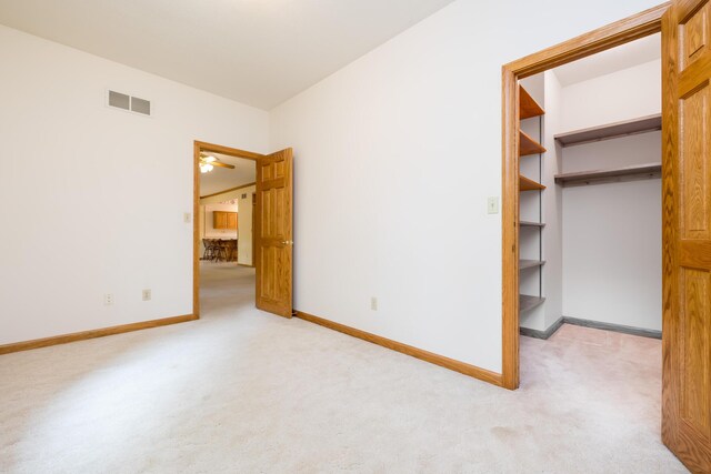 129 Tanglewood Dr, West Liberty, OH 43357 - carpeted empty room with baseboards and ceiling fan